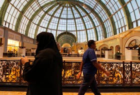 A woman walks near the fashion dome at the shopping center Mall of the Emirates in Dubai, January 11, 2012. 