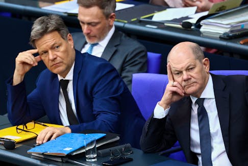 German Chancellor Olaf Scholz, German Finance Minister Christian Lindner and German Economy, and Climate Minister Robert Habeck attend a session of the lower house of parliament, Bundestag, in the Reichstag Building, in Berlin, Germany, March 20, 2024.