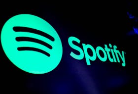 A screen displays the logo of Spotify on the floor at the New York Stock Exchange (NYSE) in New York City, U.S., December 4, 2023. 