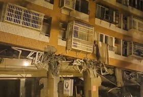 A building, which, according to the Hualien government, is unoccupied after it was previously damaged in an earlier quake on April 3, is seen following a series of earthquakes, in Hualien, Taiwan April 23, 2024 in this still image obtained from social media video.  Suhua Highway/via REUTERS