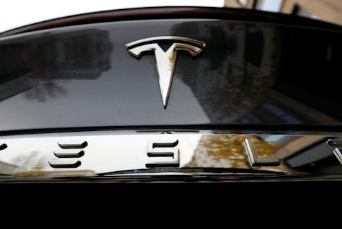 The company logo is pictured on a Tesla Model X electric car in Berlin, Germany, November 13, 2019.