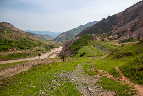 A view shows a river in a mountainous area near the town of Mailuu-Suu in the Jalal-Abad region, Kyrgyzstan, April 20, 2024. Dams holding vast amounts of uranium mine tailings above the fertile Fergana valley in Central Asia are unstable, threatening a possible Chernobyl-scale nuclear disaster if they collapse that would make the region uninhabitable, studies have revealed.