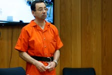 Larry Nassar, a former team USA Gymnastics doctor who pleaded guilty in November 2017 to sexual assault charges, stands in court during his sentencing hearing in the Eaton County Court in Charlotte, Michigan, U.S., February 5, 2018. 