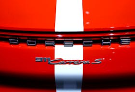 A logo on a Porsche 911 Carrera S is on display during the 75 years Porsche sports car exhibition "Driven by Dreams" in Berlin, Germany, January 25, 2023.