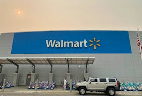 A shopper leaves a Walmart Supercenter in Secaucus, New Jersey, U.S., June 7, 2023.