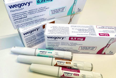Injection pens and boxes of Novo Nordisk's weight-loss drug Wegovy are shown in this photo illustration in Oslo, Norway, November 21, 2023.