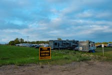 A view shows a campsite set up in a field for evacuees, after an evacuation order was declared due to the proximity of a wildfire in Yellowknife, outside of High Level, Alberta, Canada August 18, 2023. 