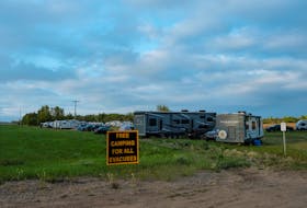 A view shows a campsite set up in a field for evacuees, after an evacuation order was declared due to the proximity of a wildfire in Yellowknife, outside of High Level, Alberta, Canada August 18, 2023. 