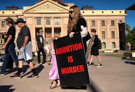 Anti-abortion activists demonstrate outside of the Arizona State Capitol before Arizona State Legislature House Democrats try again to repeal an 1864 law that bans nearly all abortions, before a session in the state legislature in Phoenix, Arizona, U.S. April 24, 2024.