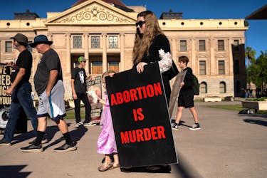 Anti-abortion activists demonstrate outside of the Arizona State Capitol before Arizona State Legislature House Democrats try again to repeal an 1864 law that bans nearly all abortions, before a session in the state legislature in Phoenix, Arizona, U.S. April 24, 2024.
