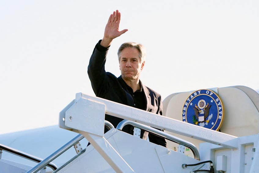 U.S. Secretary of State Antony Blinken waves as he boards a plane, en route to China, at Andrews Air Force Base, Maryland, U.S., April 23, 2024. Mark Schiefelbein/Pool via REUTERS