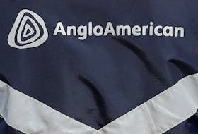 The logo of Anglo American is seen on a jacket of an employee at the Los Bronces copper mine, in the outskirts of Santiago, Chile March 14, 2019 