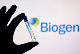 FIEL PHOTO: A test tube is seen in front of displayed Biogen logo in this illustration taken, December 1, 2021.