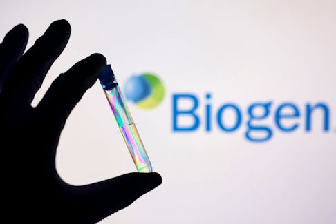 FIEL PHOTO: A test tube is seen in front of displayed Biogen logo in this illustration taken, December 1, 2021.