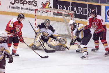 Cape Breton’s Marc-Andre Fleury, middle, waits for a shot at the top of the crease during a first-round playoff series against the Baie-Comeau Drakkar in March 2002. Cape Breton won the series in five games. CAPE BRETON POST FILE PHOTO