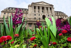 Spring flowers bloom in front of the Bank of England building, in London, Britain, March 21, 2024.