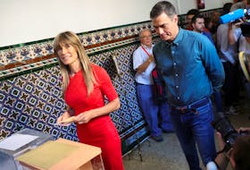 Spain's Socialist leader and Prime Minister Pedro Sanchez looks on as his wife Begona Gomez votes during the general snap election in Madrid, Spain, July 23, 2023.