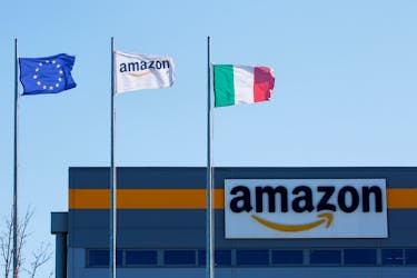 Flags flutter outside a distribution centre, during a strike at Amazon's logistics operations in Italy, in Passo Corese, Italy March 22, 2021.