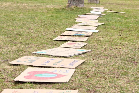 Signs made by P.E.I. students for an Earth Day demonstration in 2023 are lined up at Colonel Gray High School. Guardian file