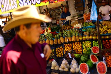 Employees work at a stall in an outdoor market dedicated to the sale of fruits and vegetables, in Ciudad Juarez, Mexico July 27, 2023.