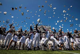 Graduating cadets toss their hats into the air at the end of the 2023 graduation ceremony at the United States Military Academy (USMA) at West Point, New York, U.S., May 27, 2023.