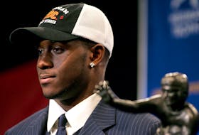 Winner of the 2005 Heisman Trophy, Reggie Bush of the University of Southern California, poses with the award in New York, December 10, 2005.