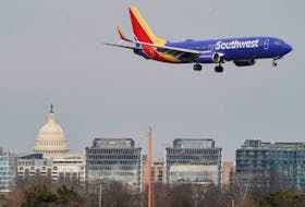 A Southwest Airlines aircraft flies past the U.S. Capitol before landing at Reagan National Airport in Arlington, Virginia, U.S., January 24, 2022.