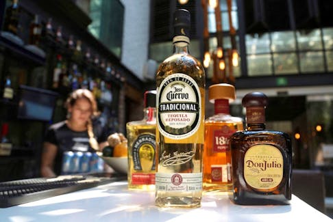 Bottles of tequila Jose Cuervo, Don Julio, 1800 and Herradura are displayed at a bar in this picture illustration taken April 4, 2019.