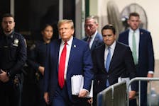 Republican presidential candidate and former U.S. President Donald Trump walks with his attorney Todd Blanche, as his criminal trial over charges that he falsified business records to conceal money paid to silence porn star Stormy Daniels in 2016 continues, at Manhattan state court in New York City, U.S., April 23, 2024.