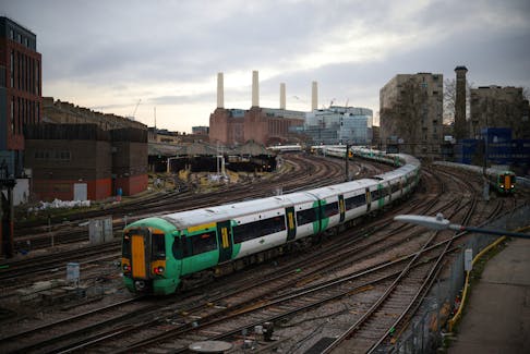 A train passes in front of Battersea Power Station as it enters Victoria station in London, Britain, February 10, 2023.