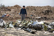American civil aviation and Boeing investigators search through the debris at the scene of the Ethiopian Airlines Flight ET 302 plane crash, near the town of Bishoftu, southeast of Addis Ababa, Ethiopia March 12, 2019.