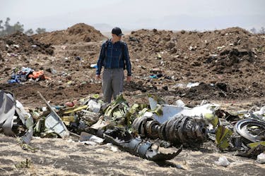 American civil aviation and Boeing investigators search through the debris at the scene of the Ethiopian Airlines Flight ET 302 plane crash, near the town of Bishoftu, southeast of Addis Ababa, Ethiopia March 12, 2019.