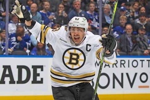 Brad Marchand #63 of the Boston Bruins celebrates a goal by Jake DeBrusk (not shown) against the Toronto Maple Leafs in Game Three of the First Round of the 2024 Stanley Cup Playoffs at Scotiabank Arena on April 24, 2024 in Toronto.. The Bruins defeated the Maple Leafs 4-2. - Claus Andersen