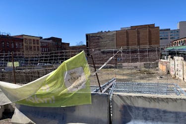 The city provided an update Monday on 99 King St. after a letter from a resident complained about wire fencing and 'tattered signage' around the stalled build site.