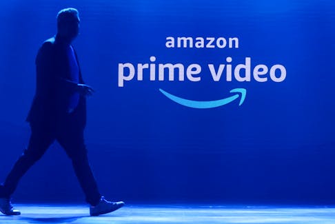 A man walks past a logo of Amazon Prime Video during a launch event in Mumbai, India, April 28, 2022.