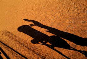 The shadow of a child who fled from attacks of armed militants in the Sahel region, is seen at a camp for internally displaced people (IDPs) in Kaya, Burkina Faso November 23, 2020. Picture taken November 23, 2020.