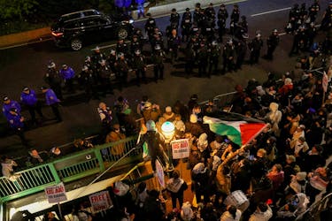 Demonstrators face off with NYPD officials outside the main entrance of Columbia University, as they stand in solidarity with the ongoing protests in support of Palestinians happening on the university campus, during the ongoing conflict between Israel and the Palestinian Islamist group Hamas, in New York City, U.S., April 24, 2024.