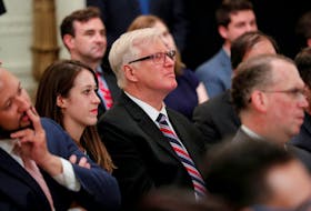 Gateway Pundit publisher Jim Hoft listens as U.S. President Donald Trump speaks during a "social media summit" meeting with prominent conservative social media figures in the East Room of the White House in Washington, U.S., July 11, 2019.