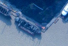 A ship, identified by the Royal United Services Institute (RUSI) as the North Korean registered cargo ship Angara, is seen docked alongside a larger vessel at the Zhoushan Xinya Shipbuilding Co wharf in Zhoushan, China February 11, 2024 in a satellite image.  Planet Labs PBC/Handout via
