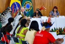 Brazil's President Luiz Inacio Lula da Silva and Minister of Indigenous Peoples Sonia Guajajara attend a meeting with Indigenous people on the day of a protest to demand the demarcation of land and to defend cultural rights, in Brasilia, Brazil April 25, 2024.