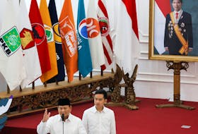Indonesia's president-elect Prabowo Subianto delivers his speech while vice president-elect Gibran Rakabuming Raka stands beside him at General Election Commission (KPU) headquarters AS the country's election commission officially announced them as the presidential election winners in Jakarta, Indonesia, April 24, 2024.