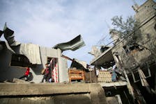 Palestinian kids inspect the site of an Israeli strike on a house, amid the ongoing conflict between Israel and the Palestinian Islamist group Hamas, in Rafah, in the southern Gaza Strip, April 25, 2024.