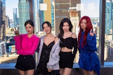 Members of the group Itzy pose in front of the Manhattan skyline during an interview with Reuters in New York, U.S., April 22, 2024.