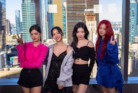 Members of the group Itzy pose in front of the Manhattan skyline during an interview with Reuters in New York, U.S., April 22, 2024.