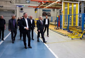 German Chancellor Olaf Scholz walks with Mathias Geisen, Head of the Mercedes-Benz Vans, Joerg Burzer, Member of the Board of Management of Mercedes-Benz and Dr. Markus Keicher, head of production and site at the Mercedes-Benz Ludwigsfelde plant, as he visits the production site of Mercedes Benz Ludwigsfelde GmbH in Ludwigsfelde in the south of Berlin, Germany, April 28, 2023.