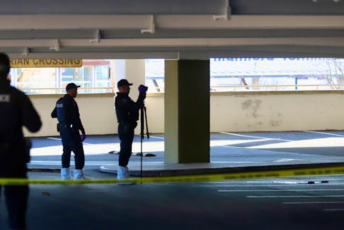 Officers with the Halifax regional police forensics unit, begin to process the scene inside a parkade at the Halifax Shopping Centre in Halifax Monday April 22, 2024.

TIM KROCHAK PHOTO