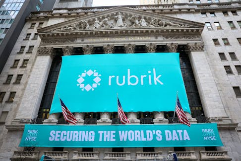 A banner for Rubrik Inc., the Microsoft backed cybersecurity software startup, is displayed to celebrate the company’s IPO at the New York Stock Exchange (NYSE) in New York City, U.S., April 25, 2024. 