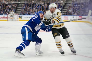 Apr 24, 2024; Toronto, Ontario, CAN; Toronto Maple Leafs forward Matthew Knies (23) battles with Boston Bruins forward Brad Marchand (63) during the second period of game three of the first round of the 2024 Stanley Cup Playoffs at Scotiabank Arena. Mandatory Credit: John E. Sokolowski-USA TODAY Sports