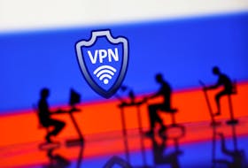 A VPN sign is seen in front of silhouetted miniatures of people with computers and the Russian flag in this illustration taken, April 23, 2024.