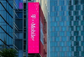 A T-Mobile logo is advertised on a building sign in Los Angeles, California, U.S., May 11, 2017.